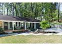 Inviting covered porch with classic rocking chairs and professional landscaping at 4323 E Durham Cir, Stone Mountain, GA 30083
