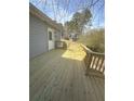 Large wooden back deck, perfect for outdoor entertaining and relaxation at 2041 Olive Springs Se Rd, Marietta, GA 30060