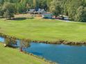 Beautiful backyard view featuring a pond and expansive green space at 441 Pumpkinvine Rd, Acworth, GA 30101