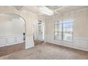 Bright dining room with wainscoting and large windows at 5619 Sawgrass Cir, Stonecrest, GA 30038