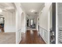 Inviting entryway featuring hardwood floors, elegant arches, and detailed wainscoting at 5619 Sawgrass Cir, Stonecrest, GA 30038