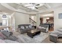 Spacious living room featuring a coffered ceiling and open floor plan at 5619 Sawgrass Cir, Stonecrest, GA 30038