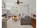 Bright living room featuring hardwood floors, a decorative fireplace, and ample natural light at 1095 Boulevard Se Dr, Atlanta, GA 30317