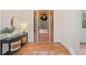 Welcoming foyer featuring hardwood floors and stylish console table decor at 776 Geneva Rd, Canton, GA 30114