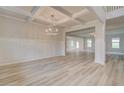 Bright dining room with decorative trim and a modern chandelier at 428 Hatcher Ct, Hampton, GA 30228