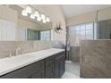 Elegant bathroom featuring a double vanity, a glass-enclosed shower, and modern fixtures at 3850 Pilgrim Mill Rd, Cumming, GA 30041