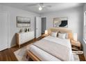 Serene main bedroom with hardwood floors, neutral decor, and modern furnishings promotes relaxation at 233 Bay Creek Rd, Loganville, GA 30052