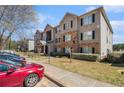 Apartment building with stone accents, covered entryway, and lawn; convenient parking at 5303 Fairington Club Dr # 5303, Lithonia, GA 30038