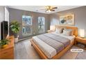 Comfortable bedroom with a bed, soft carpet, and plenty of natural light at 165 N River Dr # G, Atlanta, GA 30350