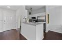 Well-lit kitchen and entryway featuring granite countertops, stainless appliances, and ample cabinet space at 2700 Pine Tree Ne Rd # 1211, Atlanta, GA 30324