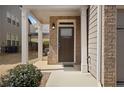 Close-up of a front door with traditional design and brick surround at 2308 Oakton Se Pl, Smyrna, GA 30082