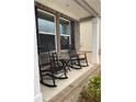 Cozy front porch featuring classic rocking chairs and a welcoming 'Hello' sign at 750 Great Oak Pl, Villa Rica, GA 30180