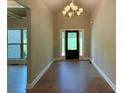 Welcoming foyer with hardwood floors, chandelier lighting, and a view of the front door at 125 Honey Creek Rd, Conyers, GA 30094