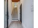 Bright entryway with hardwood floors, staircase, and modern interior design at 2323 Mason Dr # D21, Atlanta, GA 30316