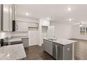 Spacious kitchen featuring granite countertops, stainless steel appliances, and hardwood floors, perfect for culinary enthusiasts at 464 Reflection Dr # 22, Stockbridge, GA 30281