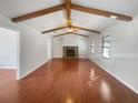 Inviting living room with vaulted ceilings, exposed beams and a stone fireplace at 4508 N Bay Ct, Marietta, GA 30066