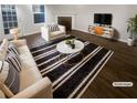 Bright living room features modern decor, fireplace, and stylish furniture at 474 Berckman Nw Dr, Lilburn, GA 30047