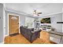 Bright and airy living room featuring hardwood floors, a ceiling fan, and comfortable seating at 3351 Phillip Cir, Decatur, GA 30032