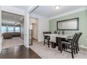 Elegant dining room featuring modern decor, a stylish table, and plush carpeting at 3391 Meadow Grass Dr, Dacula, GA 30019