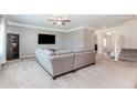 Spacious living room with neutral tones, plush carpeting, and abundant natural light at 3391 Meadow Grass Dr, Dacula, GA 30019