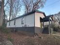 View of the side exterior showcasing the home's siding, windows, and the front porch at 1170 Booker Sw Ave, Atlanta, GA 30310