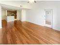 Hardwood floors accentuate the home's open living space, leading to the kitchen area at 1250 Parkwood Se Cir # 2309, Atlanta, GA 30339