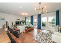 Bright open-concept living space featuring hardwood floors, large windows, and stylish decor at 456 Millsap Way, Marietta, GA 30060