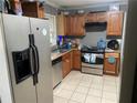 A functional kitchen featuring stainless steel appliances and ample countertop space at 4574 Cedar Ridge Trl, Stone Mountain, GA 30083