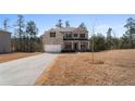 Beautiful two-story home with landscaped yard, showcasing the well-maintained exterior at 514 Eagles Pt, Fairburn, GA 30213