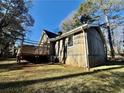 Spacious backyard featuring a wooden deck, perfect for outdoor entertaining and relaxation at 3252 Westbrook Trce, Lawrenceville, GA 30044