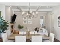 Elegant dining area with coffered ceilings and a fireplace, perfect for entertaining at 3332 Old Concord Se Rd, Smyrna, GA 30082