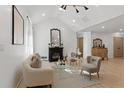 Bright living room featuring modern lighting, white walls, and hardwood flooring at 1649 Derry Sw Ave, Atlanta, GA 30310