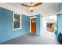 Inviting front porch featuring painted brick and a stylish ceiling fan at 1453 Hartford Sw Ave, Atlanta, GA 30310