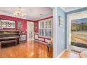 Charming music room featuring hardwood floors, piano, and bright colors, filled with natural light at 340 Nail Rd, Mcdonough, GA 30253