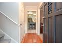 Entry hall with hardwood floors leading to kitchen with skylight at 1438 Ridgeland Sw Ct, Lilburn, GA 30047