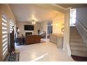 Spacious living room features a fireplace, wet bar, and staircase to the upper level at 1185 Whitehawk Trl, Lawrenceville, GA 30043