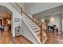 Open staircase leading to the second floor, complemented by hardwood floors and fresh paint at 1915 Turtle Creek Way, Lawrenceville, GA 30043