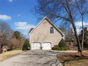 Spacious two-car garage with a large driveway and well-maintained landscaping at 918 Fox Hollow Way, Marietta, GA 30068