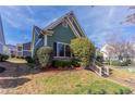 Angle view of a house with well-maintained landscaping with trees, bushes, and a brick walkway at 966 Westmoreland Nw Cir, Atlanta, GA 30318