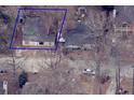 Aerial view of a property with a home and surrounding trees and vegetation, showing its overall layout at 1425 Rome Dr, Atlanta, GA 30314