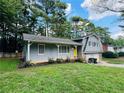 Inviting home featuring a cozy porch and vibrant yellow door at 3210 Ebenezer Rd, Marietta, GA 30066