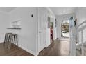 Bright entryway with hardwood floors, white walls, and a view into the kitchen at 1923 Ivy Glen Se Dr, Smyrna, GA 30082