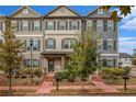 Attractive townhome exterior with brick path, manicured bushes and small decorative trees at 3651 Princeton Ave, Atlanta, GA 30337