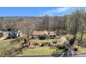 Lovely aerial view of a home with a spacious yard and serene surroundings at 133 Hickory Trl, Cumming, GA 30040