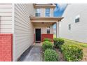 Inviting front porch with stylish landscaping and a secure entry door, creating a welcoming entrance at 1332 Worcester Trl, Mcdonough, GA 30253