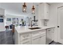 Kitchen with quartz countertop island, stainless steel dishwasher, and modern lighting at 1101 Juniper Ne St # 519, Atlanta, GA 30309