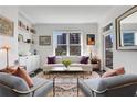 Cozy living room with comfortable seating, built-in shelving, and a large window with city views at 1101 Juniper Ne St # 519, Atlanta, GA 30309