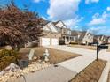 Exterior view from street showing the house, landscaping and front yard, side walk and neighborhood at 2536 Kachina Trl, Dacula, GA 30019
