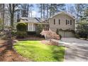 Charming two-story home featuring a well-manicured front yard and a two-car garage at 2630 Orchard Knob Se, Atlanta, GA 30339
