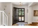 Inviting foyer with hardwood floors and a view of the front yard through the glass-paneled door at 2630 Orchard Knob Se, Atlanta, GA 30339